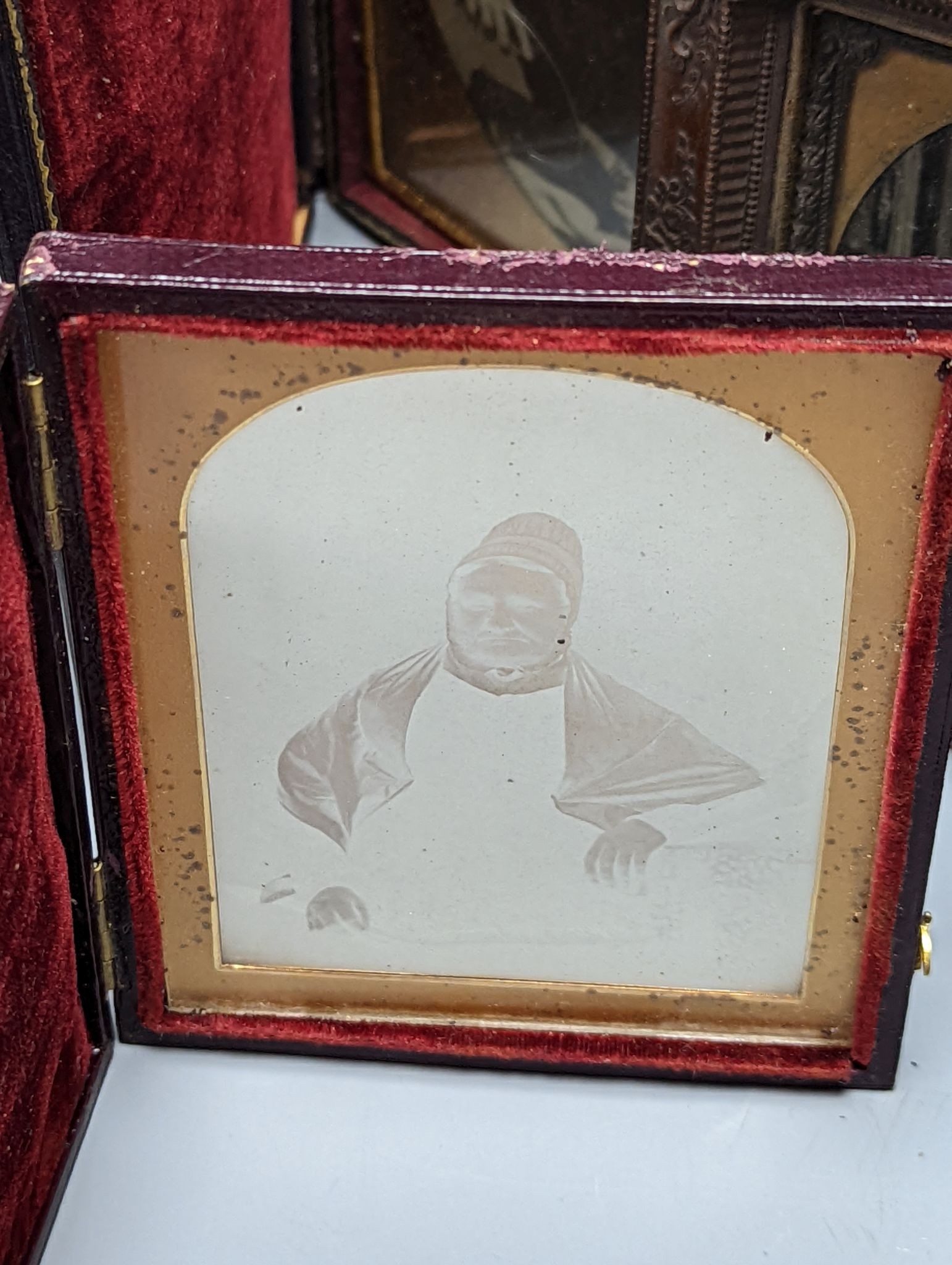 A 19th century cased Daguerreotype of a lady, six cased Ambrotype portraits and three 19th/20th century albums/diaries (two vacant). (10 items)